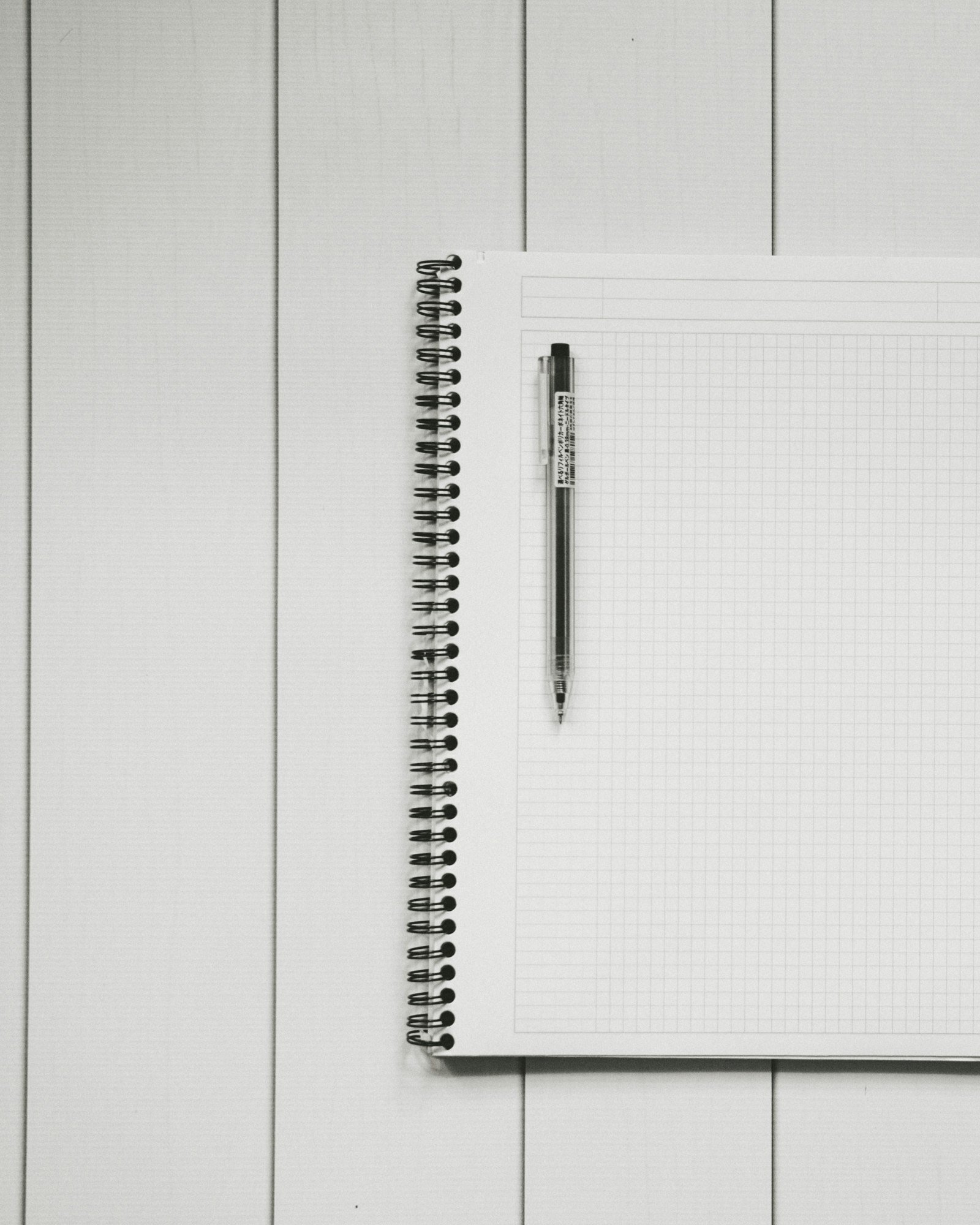 Open notebook and pen ready for planning your book project